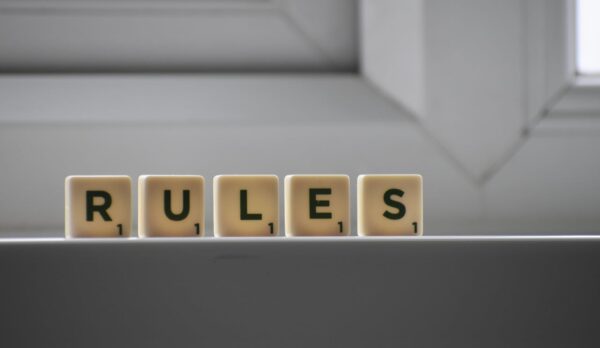 RULES spelled out in Scrabble tile.