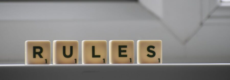 RULES spelled out in Scrabble tile.